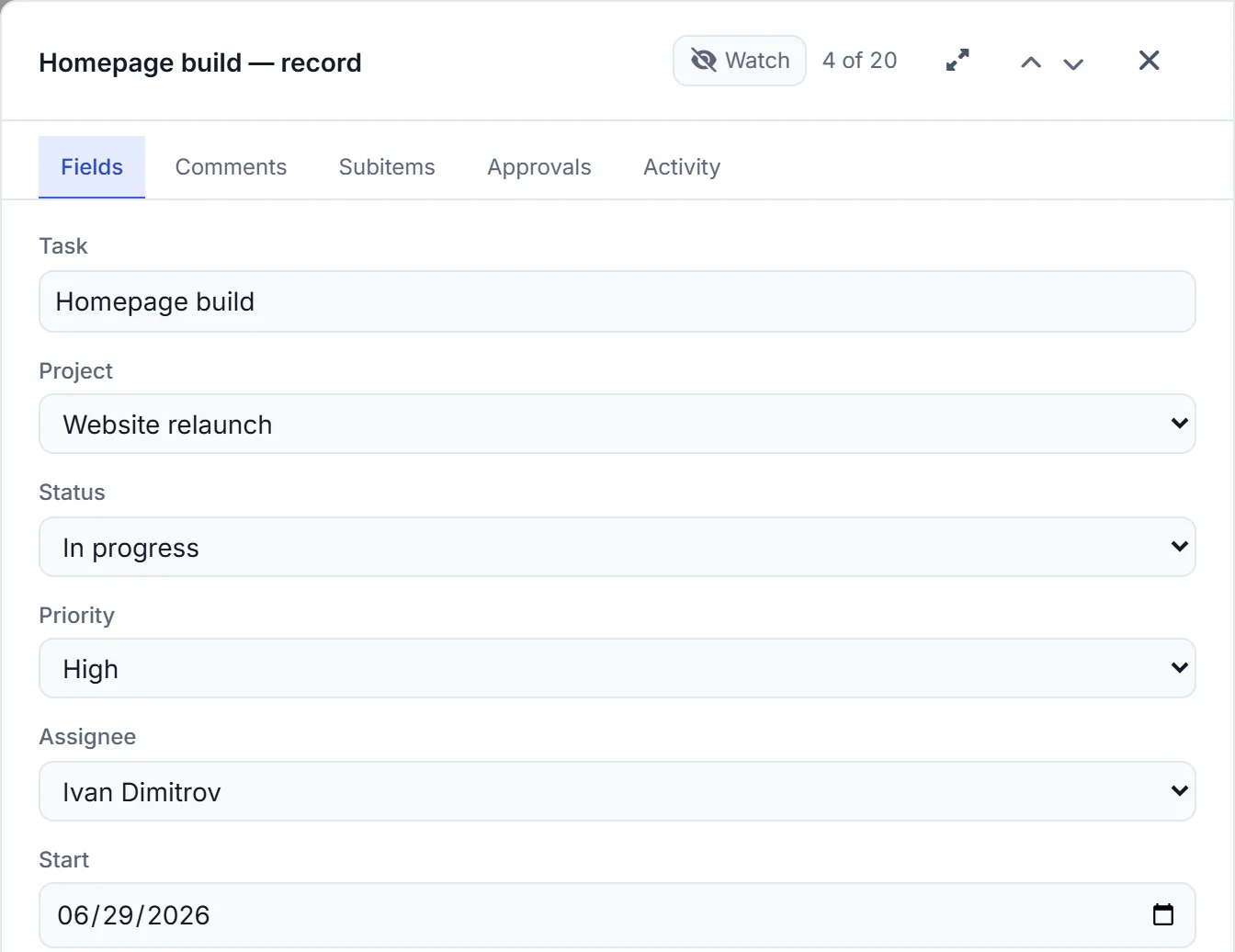 One task opened as a record: its project, status, priority, the person responsible and the start date